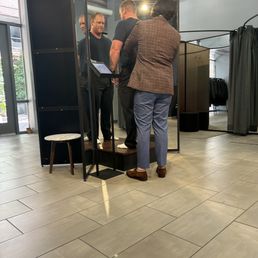Getting measured for a 3-piece suit