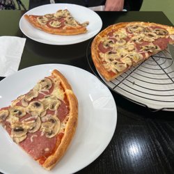 Pizza Pasta Americano - Sauce, pepperoni and mushrooms. Crisp crust! Lightweight, and you don't feel like you got run over after eating like in the US.