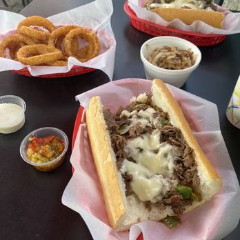 John's Philly Grille - Green pepper cheesesteak with onion rings and onion/peppers on the side - Cheesesteaks Near Me - Seal Beach, California John's Philly Grille - Green pepper cheesesteak with onion rings and onion/peppers on the side - Cheesesteaks Near Me - Seal Beach, California