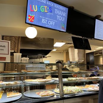 Luigi's Pizzeria - a man standing in front of the counter - Pizza Near Me - East Setauket, New York Luigi's Pizzeria - a man standing in front of the counter - Pizza Near Me - East Setauket, New York