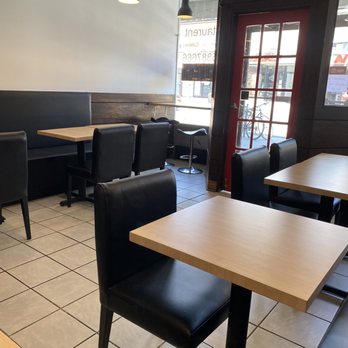 Hana Sushi - empty tables and chairs in a restaurant - Sushi Bars Near Me - Toronto, Ontario