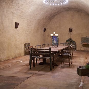 Spring Mountain Vineyard - a dining room with a chandelier - Wineries Near Me - Saint Helena, California Spring Mountain Vineyard - a dining room with a chandelier - Wineries Near Me - Saint Helena, California
