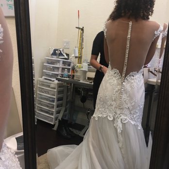 Bridal Gown Studio Orlando - All the clutter in the tiny room being reflected on the room's single, small mirror. - Bridal Near Me - Orlando, Florida Bridal Gown Studio Orlando - All the clutter in the tiny room being reflected on the room's single, small mirror. - Bridal Near Me - Orlando, Florida