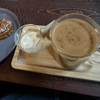 Bonfire - Decaf Americano with cinnamon, vanilla extract and oat milk with mooncake - New American Near Me - Bigfork, Montana Bonfire - Decaf Americano with cinnamon, vanilla extract and oat milk with mooncake - New American Near Me - Bigfork, Montana