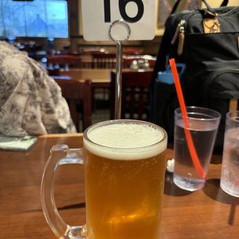 Barro's Pizza - a glass of beer on a table - Pizza Near Me - Marana, Arizona