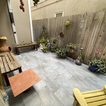 Fam Bathroom Remodeling - a patio with a bench and a table - General Contractors Near Me Fam Bathroom Remodeling - a patio with a bench and a table - General Contractors Near Me