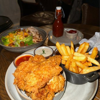 Yardbird - Yard bird tenders (front) and grilled mango salad with grilled chicken (back) - Southern Near Me - Las Vegas, Nevada
