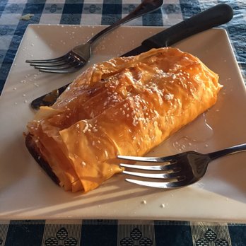 Mikonos Restaurant - Galagtobureko dessert - lemony custard wrapped in phyllo dough with drizzled honey on top - Greek Near Me - Ewing, New Jersey Mikonos Restaurant - Galagtobureko dessert - lemony custard wrapped in phyllo dough with drizzled honey on top - Greek Near Me - Ewing, New Jersey