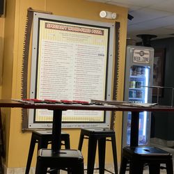 Kindles Pizzeria - Menu and drinks, and a fun oversized checkers board
