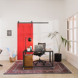 Sunburst Shutters & Window Fashions - Slide to the left for privacy-slide to the right to escape the work zone at home! A sliding barn door in red is the perfect splash of color