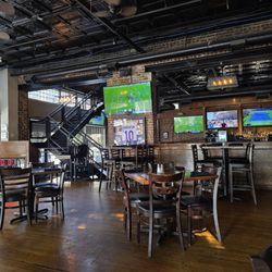 202 Social House - The main dining room of the restaurant with the bar in the background.