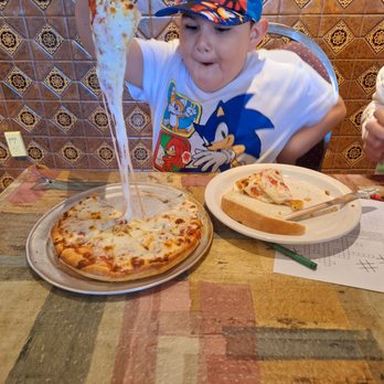 Pina Pizza House - Look at the cheeseeeee!!!!! He was happy! - Pizza Near Me - Downey, California Pina Pizza House - Look at the cheeseeeee!!!!! He was happy! - Pizza Near Me - Downey, California