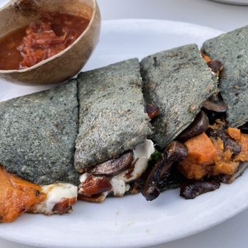 Bombera - Yam and mushroom quesadilla with Oaxacan cheese and spicy tomatillo salsa on a purple corn tortilla - Mexican Near Me - Oakland, California
