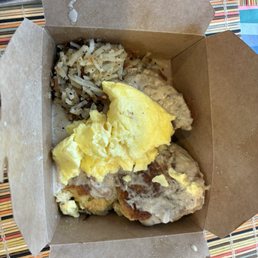 Biscuits, gravy, eggs and hash browns thrown in a box. Biscuits, gravy, eggs and hash browns thrown in a box.