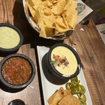 Red River Cantina - Richmond - Chips and dips (complementary). And blanco queso (bottom right and from menu) - Seafood Near Me - Richmond, Texas Red River Cantina - Richmond - Chips and dips (complementary). And blanco queso (bottom right and from menu) - Seafood Near Me - Richmond, Texas