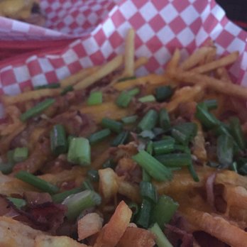 Suds Tavern - a basket of french fries with cheese and green onions - Sports Bars Near Me - Boise, Idaho