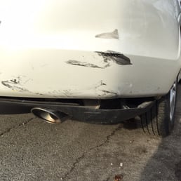 A closer look of the damage near the rear exhaust and bumper. A closer look of the damage near the rear exhaust and bumper.