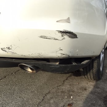 Newbridge Auto Body - A closer look of the damage near the rear exhaust and bumper. - Body Shops Near Me - North Bellmore, New York Newbridge Auto Body - A closer look of the damage near the rear exhaust and bumper. - Body Shops Near Me - North Bellmore, New York