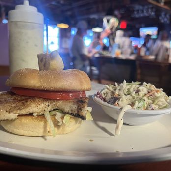 Pirates Pub & Grub - This is the $25 Grouper Sandwich. Sad little thing only had a slice of tomato and a little shredded lettuce and that's it. - American Near Me - Madeira Beach, Florida Pirates Pub & Grub - This is the $25 Grouper Sandwich. Sad little thing only had a slice of tomato and a little shredded lettuce and that's it. - American Near Me - Madeira Beach, Florida