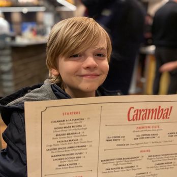 Caramba Restaurant - Me with the menu - Italian Near Me - Whistler, British Columbia Caramba Restaurant - Me with the menu - Italian Near Me - Whistler, British Columbia