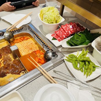 Haidilao Hotpot Katy - Tomato soup base and the Spicy soup base. Beef tongue, pork, combo veggies. - Seafood Near Me - Katy, Texas Haidilao Hotpot Katy - Tomato soup base and the Spicy soup base. Beef tongue, pork, combo veggies. - Seafood Near Me - Katy, Texas