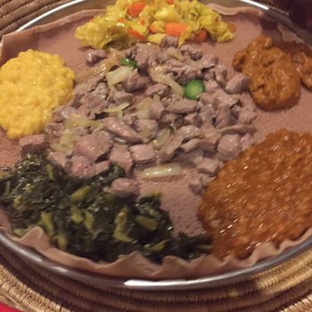 Gojo Ethiopian Restaurant - Veggie combo and Jefa tibs (marinated cubed beef with onions, jalepeno, and spiced butter). - Ethiopian Near Me - Richardson, Texas Gojo Ethiopian Restaurant - Veggie combo and Jefa tibs (marinated cubed beef with onions, jalepeno, and spiced butter). - Ethiopian Near Me - Richardson, Texas