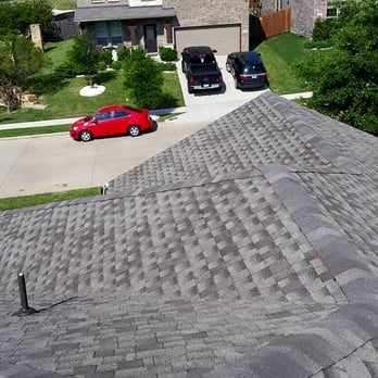 North Tex Roofing & Construction - a red car parked in front of a house - Roofing Near Me - Fort Worth, Texas North Tex Roofing & Construction - a red car parked in front of a house - Roofing Near Me - Fort Worth, Texas