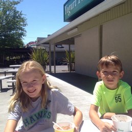 two children sitting at a table two children sitting at a table