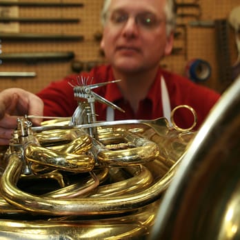 Dana Hofer Brass Repair - Dana setting pins on a tuba. - Musical Instrument Services Near Me - Des Plaines, Illinois Dana Hofer Brass Repair - Dana setting pins on a tuba. - Musical Instrument Services Near Me - Des Plaines, Illinois