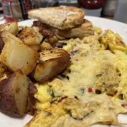 Crab omelette with sour dough toast and potatoes Crab omelette with sour dough toast and potatoes