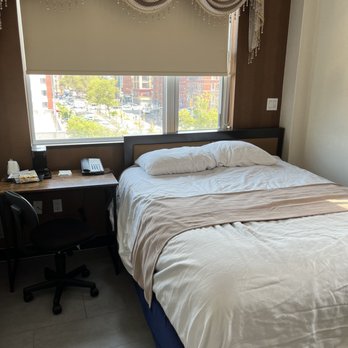 Madison Les Hotel - The other window and small desk and queen bed - Hotels Near Me - New York, New York Madison Les Hotel - The other window and small desk and queen bed - Hotels Near Me - New York, New York