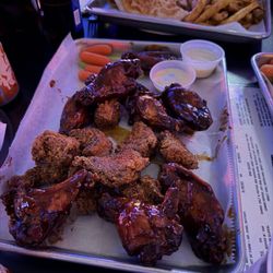 Tavern On the Rocks - Bone in (BBQ) and boneless (voo doo) wings.