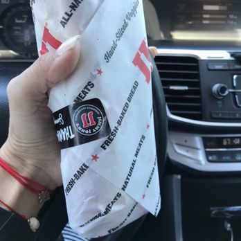 Jimmy John's - a person holding a bag of food - Sandwiches Near Me - Boca Raton, Florida Jimmy John's - a person holding a bag of food - Sandwiches Near Me - Boca Raton, Florida