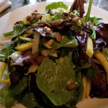 Nuestra Cocina - Baby greens salad packed with mango, pumpkin seeds, and other goodies. So delicious! - Mexican Near Me - Portland, Oregon Nuestra Cocina - Baby greens salad packed with mango, pumpkin seeds, and other goodies. So delicious! - Mexican Near Me - Portland, Oregon