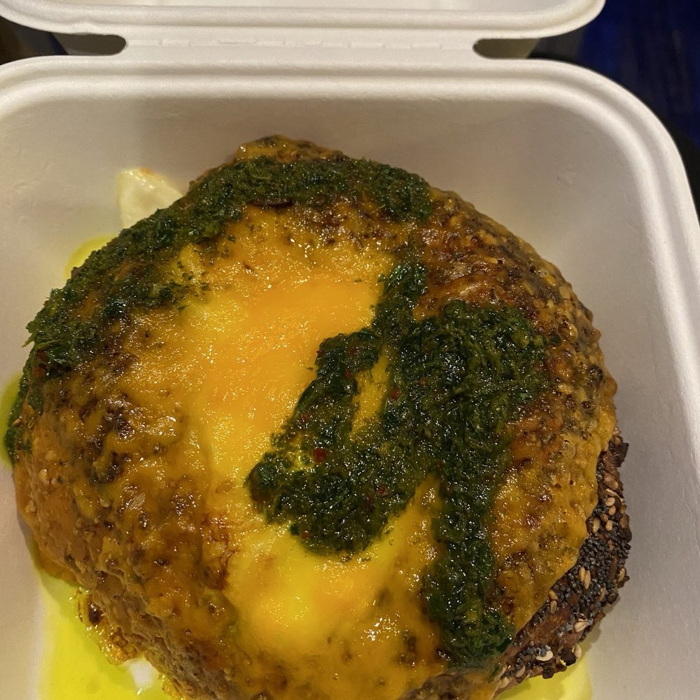 Egg and cheese bialy with zhug sauce