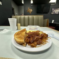 Sausage & cheese omelette, sourdough toast, hash browns, a side of bacon