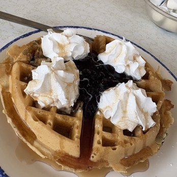 Pan American Pancake & Omelet - Golden Brown Belgian Waffle Served with Blueberries on Top - American Near Me - Myrtle Beach, South Carolina Pan American Pancake & Omelet - Golden Brown Belgian Waffle Served with Blueberries on Top - American Near Me - Myrtle Beach, South Carolina