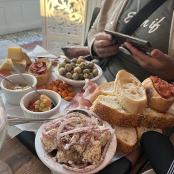 Kitty Dare - Charcuterie board - the fried olives, smokey almonds, and the barbari bread are especially standouts. - Mediterranean Near Me - Atlanta, Georgia Kitty Dare - Charcuterie board - the fried olives, smokey almonds, and the barbari bread are especially standouts. - Mediterranean Near Me - Atlanta, Georgia