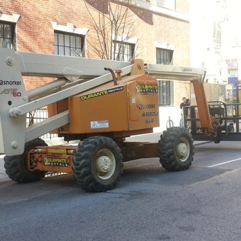 Hubert Moore Exterminator - This is a 60-foot articulating boom lift we need to use when doing our pigeon repellent treatment on multi-story buildings in New York City. - Pest Control Near Me - Port Washington, New York Hubert Moore Exterminator - This is a 60-foot articulating boom lift we need to use when doing our pigeon repellent treatment on multi-story buildings in New York City. - Pest Control Near Me - Port Washington, New York