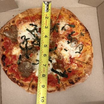Wood & Grain - This is how big for a 29.00 pizza. Crazy. Freezing cold and we ordered with meatballs. - Pizza Near Me - Mount Pleasant, South Carolina