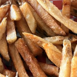 Fries cooked in dirty oil with an unpleasant taste.