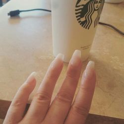 Platnium Nails and Foot Spa - Coffin nails with clear gel and one finger has glitter