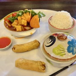Lunch sweet and sour with tofu, soup, rice, and spring rolls.