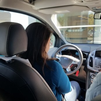 Butler Ford - Yumi begins a test drive of the 2016 Ford Transit Connect Titanium. - Car Dealers Near Me - Ashland, Oregon