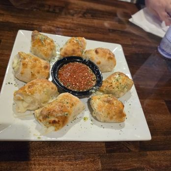 The Black Olive - Garlic knots with mozzarella and house made sauce - Italian Near Me - Johnson City, Tennessee The Black Olive - Garlic knots with mozzarella and house made sauce - Italian Near Me - Johnson City, Tennessee
