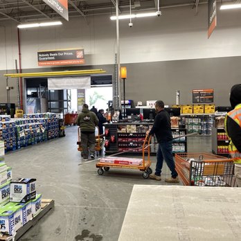 The Home Depot - Check out counter with 10 carts stacked up and waiting for cashier. - Hardware Stores Near Me - Perris, California The Home Depot - Check out counter with 10 carts stacked up and waiting for cashier. - Hardware Stores Near Me - Perris, California