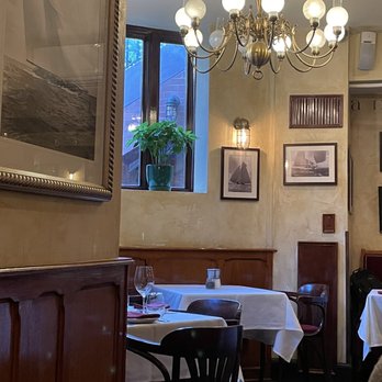La Voile - a dining room with tables and chairs - French Near Me - Boston, Massachusetts La Voile - a dining room with tables and chairs - French Near Me - Boston, Massachusetts