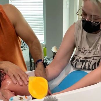 Sagan’s Birth Nerd Services - Postpartum Doula - Sagan helping/teaching my husband how to give our newborn a bath. - Doulas Near Me Sagan’s Birth Nerd Services - Postpartum Doula - Sagan helping/teaching my husband how to give our newborn a bath. - Doulas Near Me