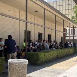 State Disability Insurance Office - Long line at Edd this doesn't end you can't even see the line that wraps around the back people are standing in the sun