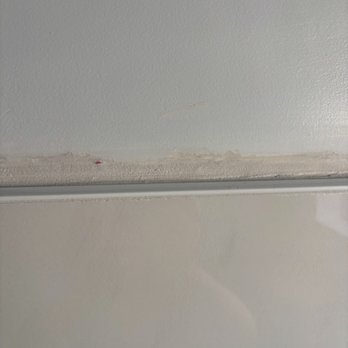 Prime Tile and Stone Construction - Grout above tiles where it meets drywall. They should've used caulking. They didn't even try to do a straight line. - General Contractors Near Me Prime Tile and Stone Construction - Grout above tiles where it meets drywall. They should've used caulking. They didn't even try to do a straight line. - General Contractors Near Me
